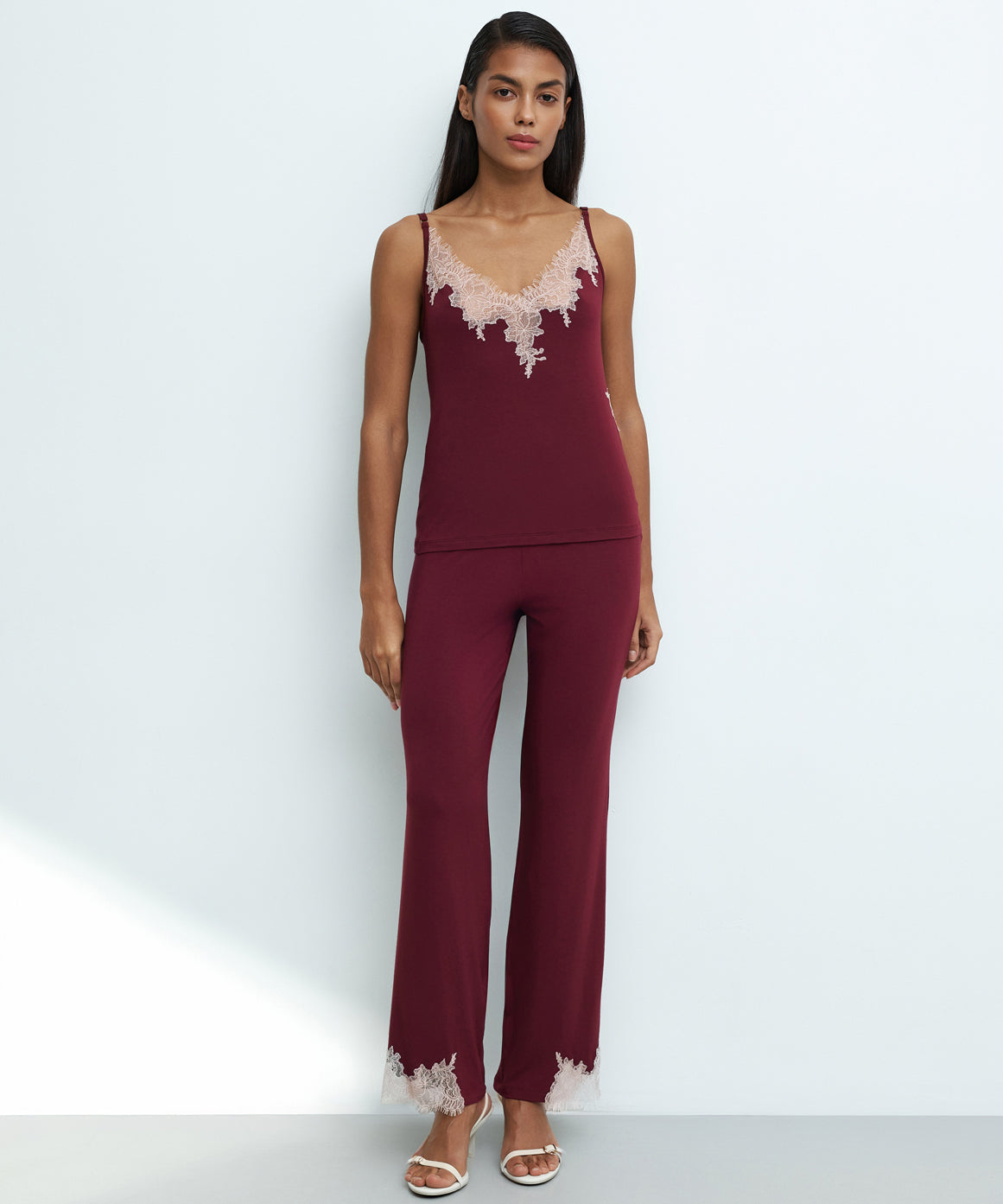 Effetto bamboo camisole pajama set 03163 – women's sleepwear, cherry lacquer
Woman wearing a burgundy camisole pajama set with lace details on a white background