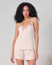 Effetto bamboo cami shorts set 03163 – women's sleepwear, rosy peach
Woman wearing a beige lace camisole and shorts set on a plain background