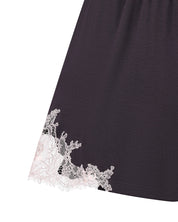 Effetto bamboo cami shorts set 03163 – women's sleepwear, smoke grey
Black dress with white lace trim on a white background