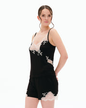 Effetto bamboo cami shorts set 03163 – women's sleepwear, black
Woman wearing a black lace nightgown with white accents on a white background