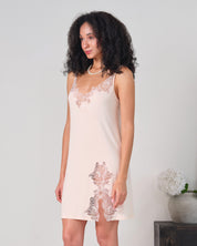 Effetto bamboo chemise spaghetti strap 03162 – women's sleepwear, rosy peach
Woman wearing a lace-trimmed nightgown against a plain background